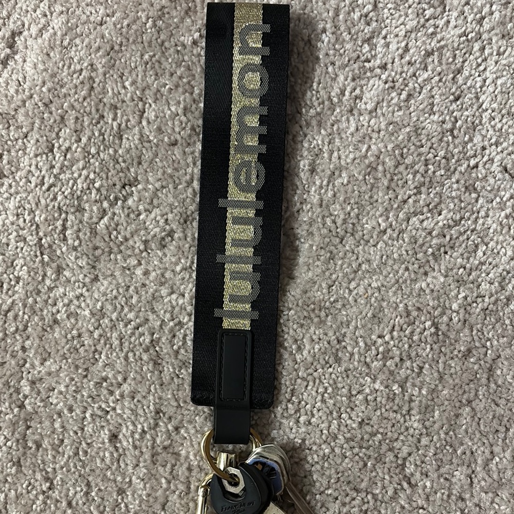 Lululemon Black and Gold Never lost keychain